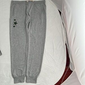 SIX FIFTY gray joggers with green camouflage stars detail on one leg